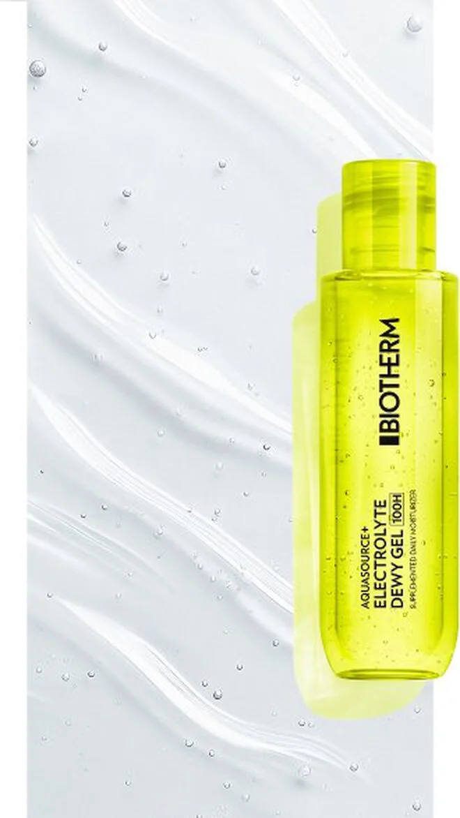 alt="Neon yellow-green transparent gel bottle with black labelling, placed against a pale background with gel texture swipes and water droplets."
